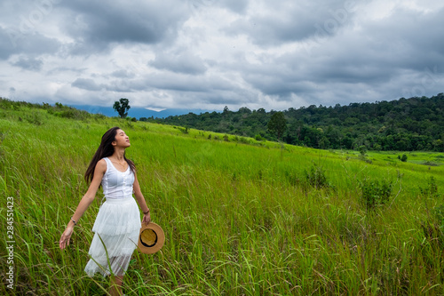 Wallpaper Mural Girl with white dress in a green field,enjoying in the sunny summer day Torontodigital.ca