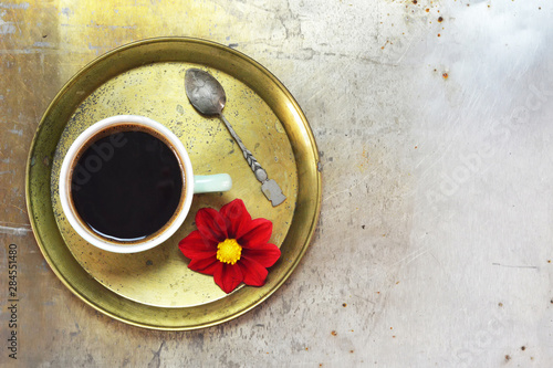 Top view of the cup of coffee on the tray