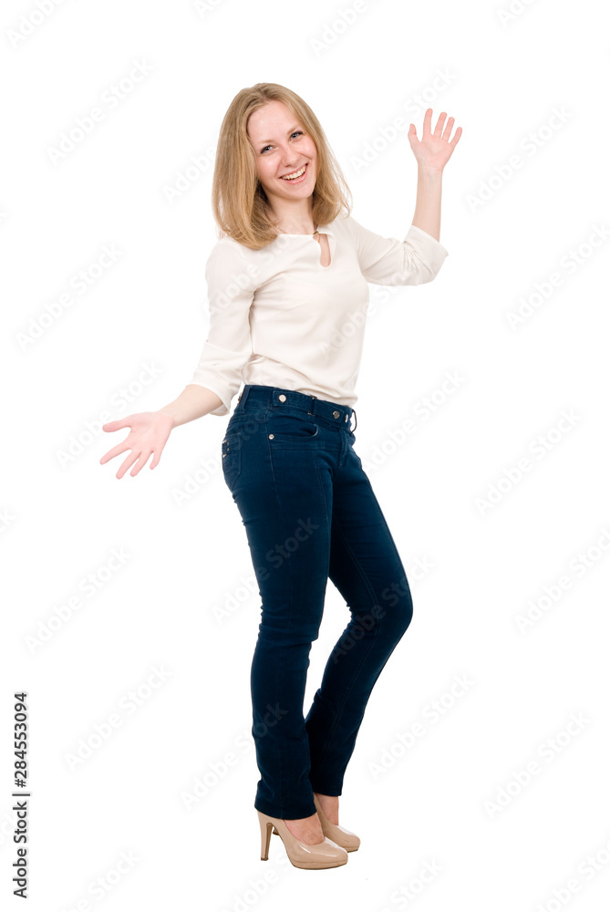 Portrait of a cheerful young woman in jeans with hands side isolated over white background Portrait of a cheerful young woman in jeans with hands side isolated over white background