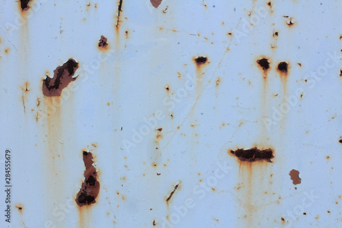 Rust stains on a gray painted iron surface