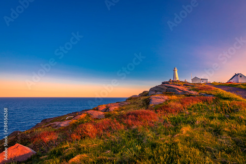 View of Cape Spear Lighthouse National Historic Site at Newfoundland Canada during sunset photo
