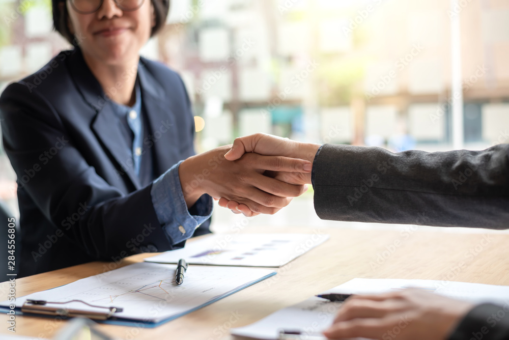 Business people shaking hands and congratulating at meeting. Business people shaking hands and congratulating at meeting.