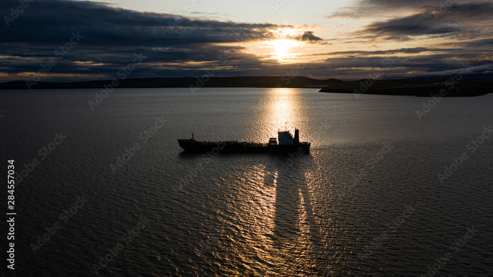 The sea vessel against the background of a sunset. The sea vessel against the background of a sunset.