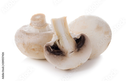 mashrooms whole and sliced champignons isolated on white background