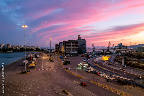 View from the deck of the ferry to the port of Piraeus in Athens at sunset. © toshket