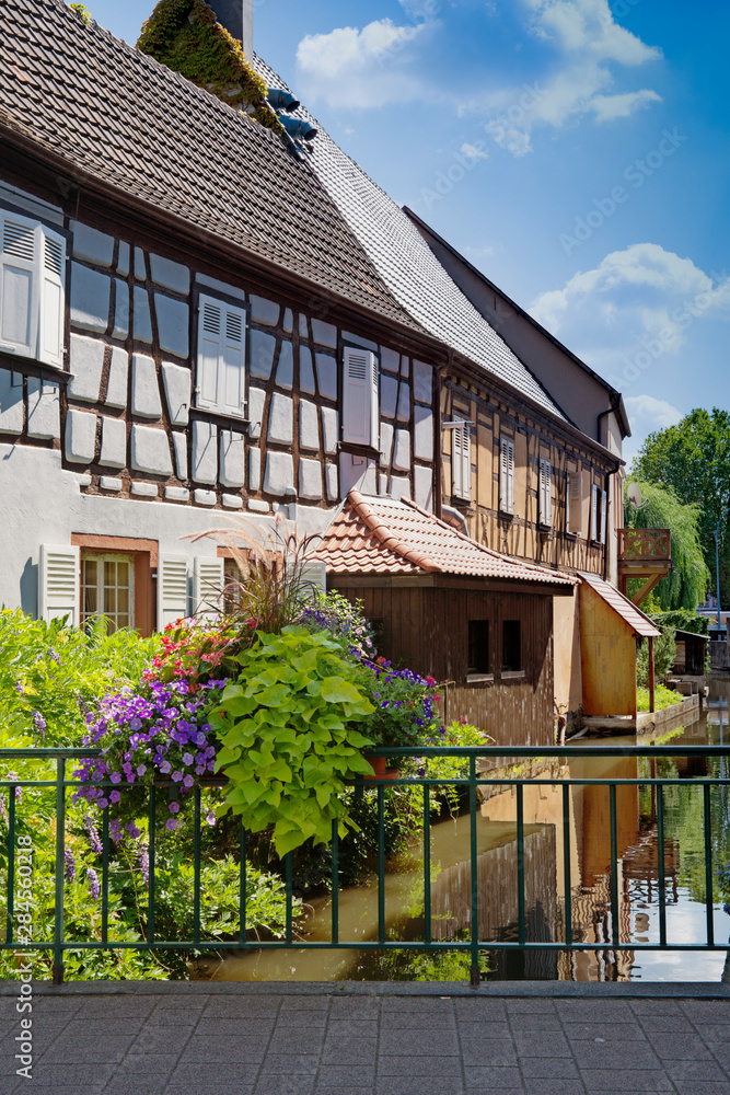 Traditional half timbered houses along canal in Wissembourg, France