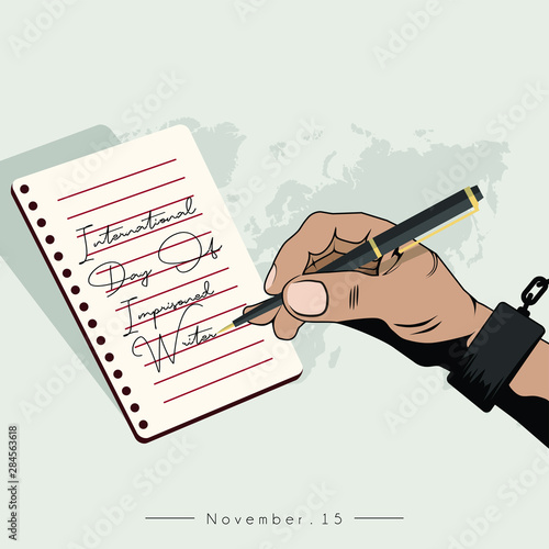 International Day Of Imprisoned Writer with the handcuffed hand is writing on note book paper
