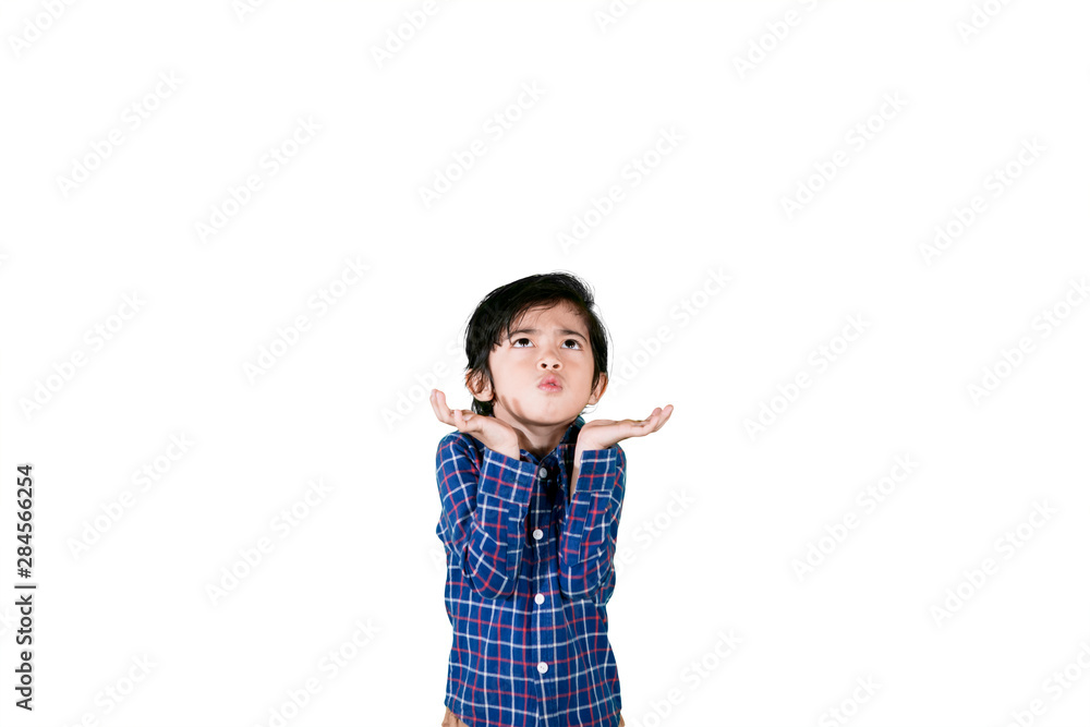 Asian little boy looks confused in the studio Asian little boy looks confused in the studio