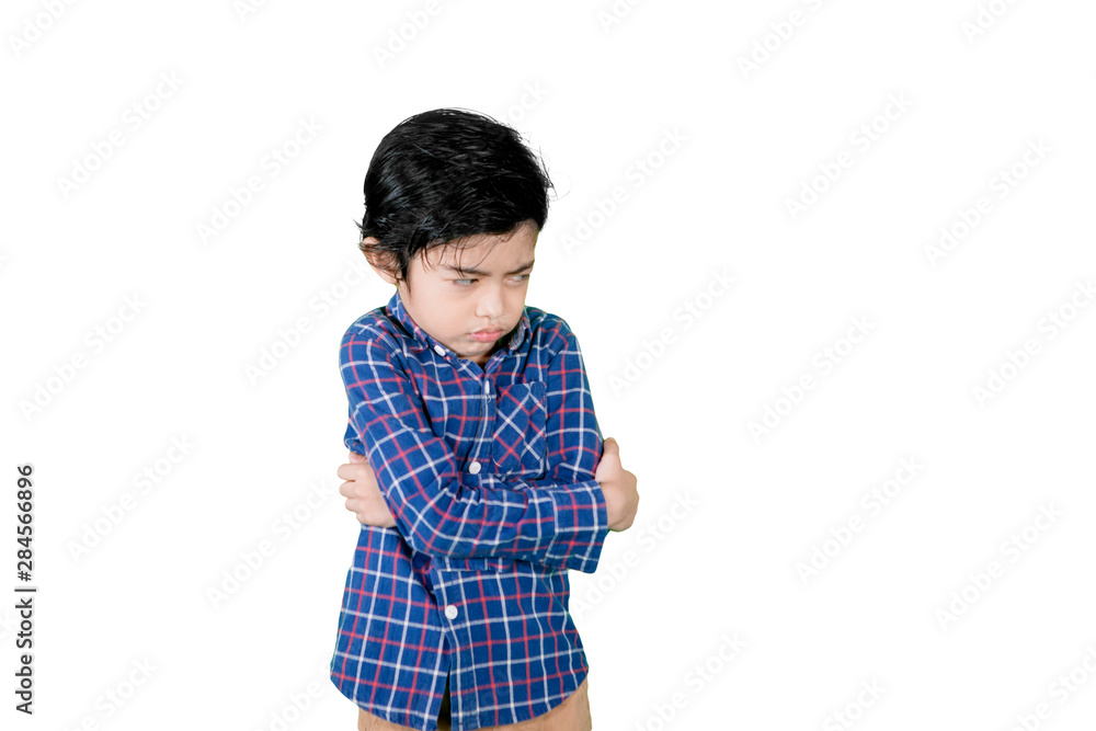 Cute little boy looks cranky in the studio Cute little boy looks cranky in the studio