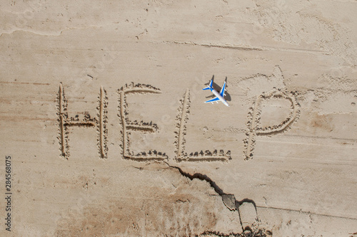 Help me the inscription and plane on the sand. Please help me. On a tropical beach © volody10