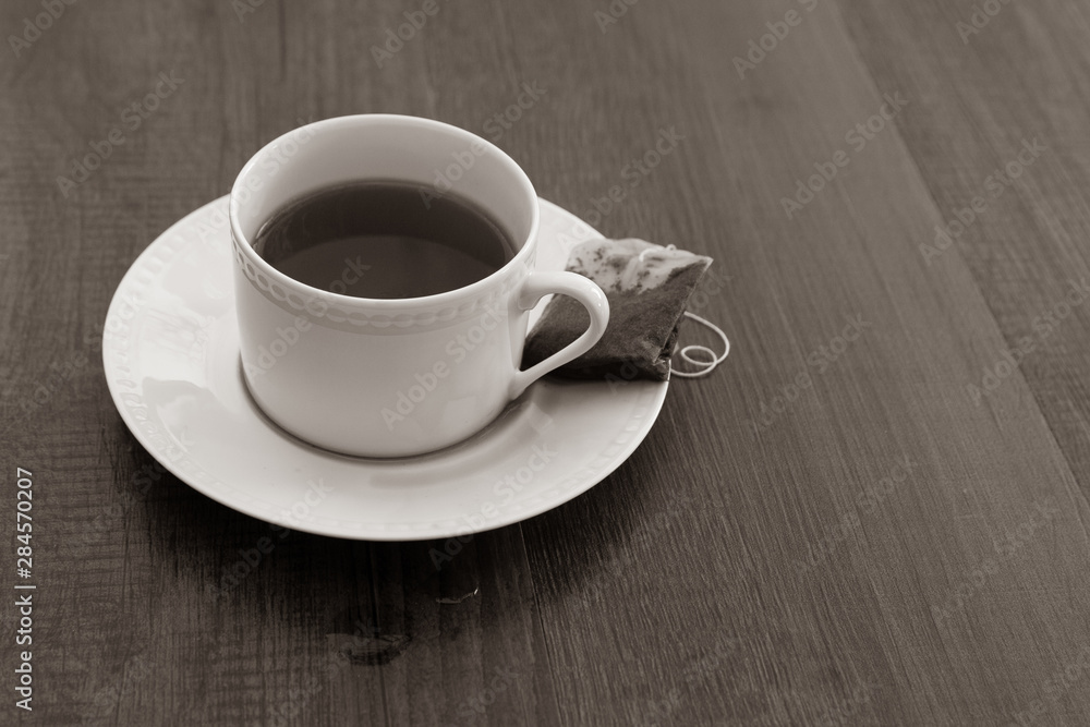 Obraz premium cup and saucer full of hot tea