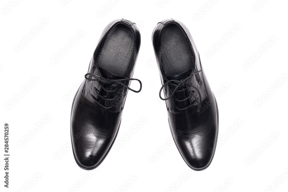 Black leather shoes isolated on a white background. Black leather shoes isolated on a white background.