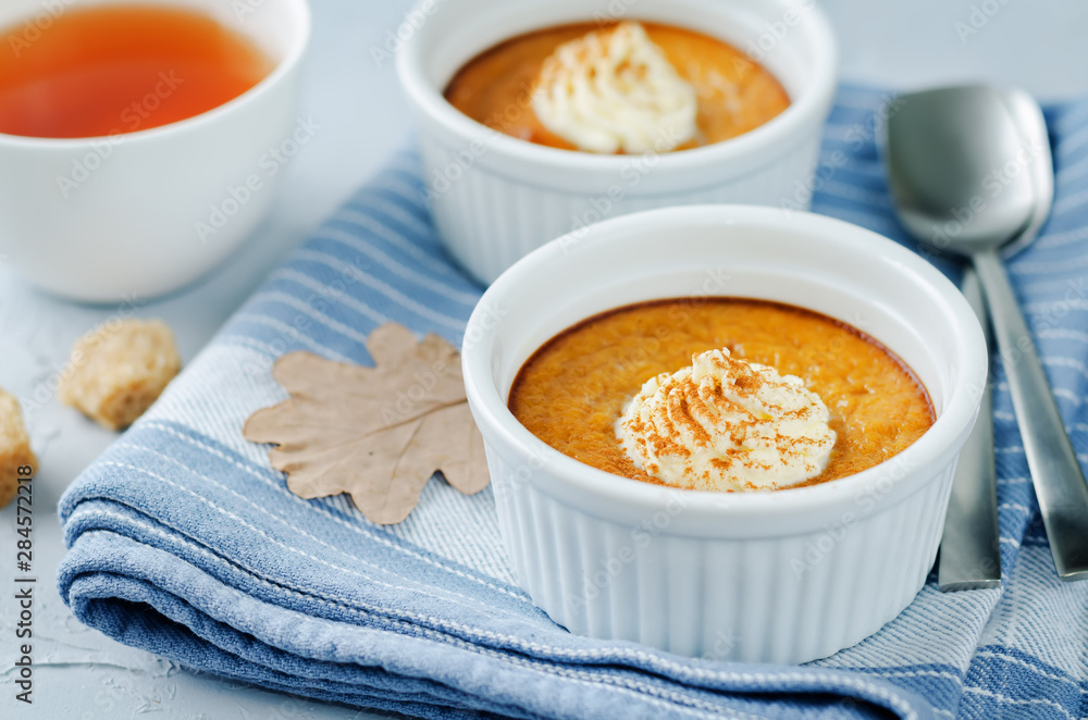 Baked Pumpkin pudding with whipped cream and cinnamon Baked Pumpkin pudding with whipped cream and cinnamon