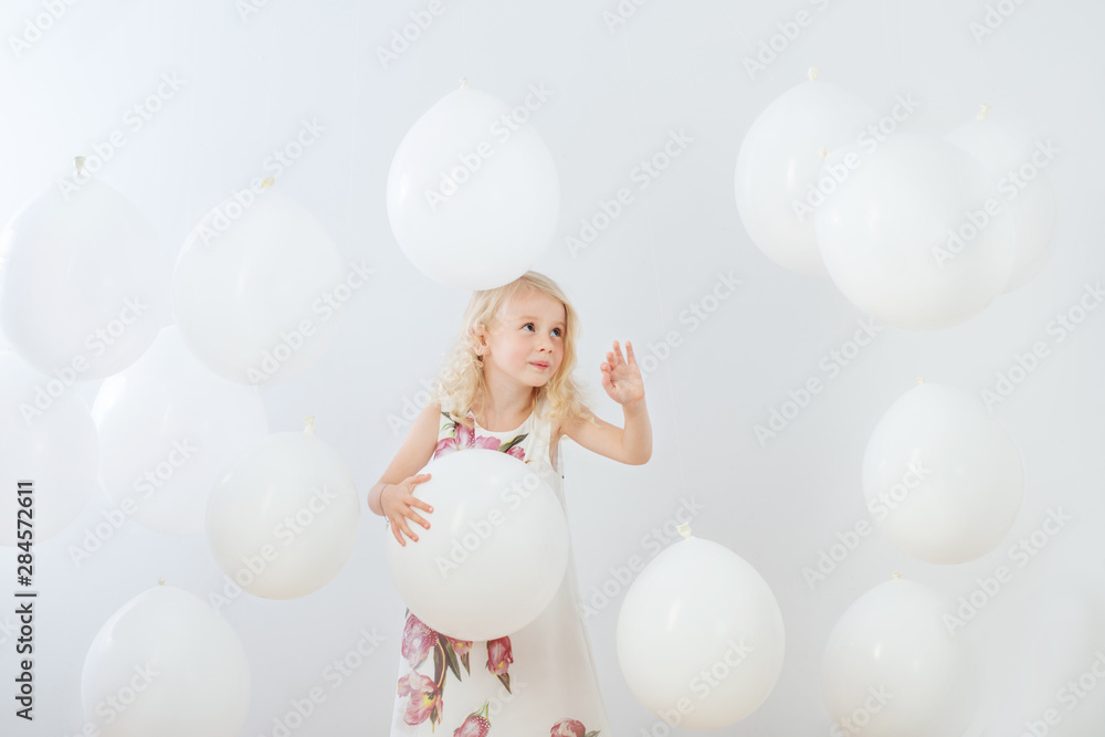 little girl with white balloons indoor - obrazy, fototapety, plakaty 