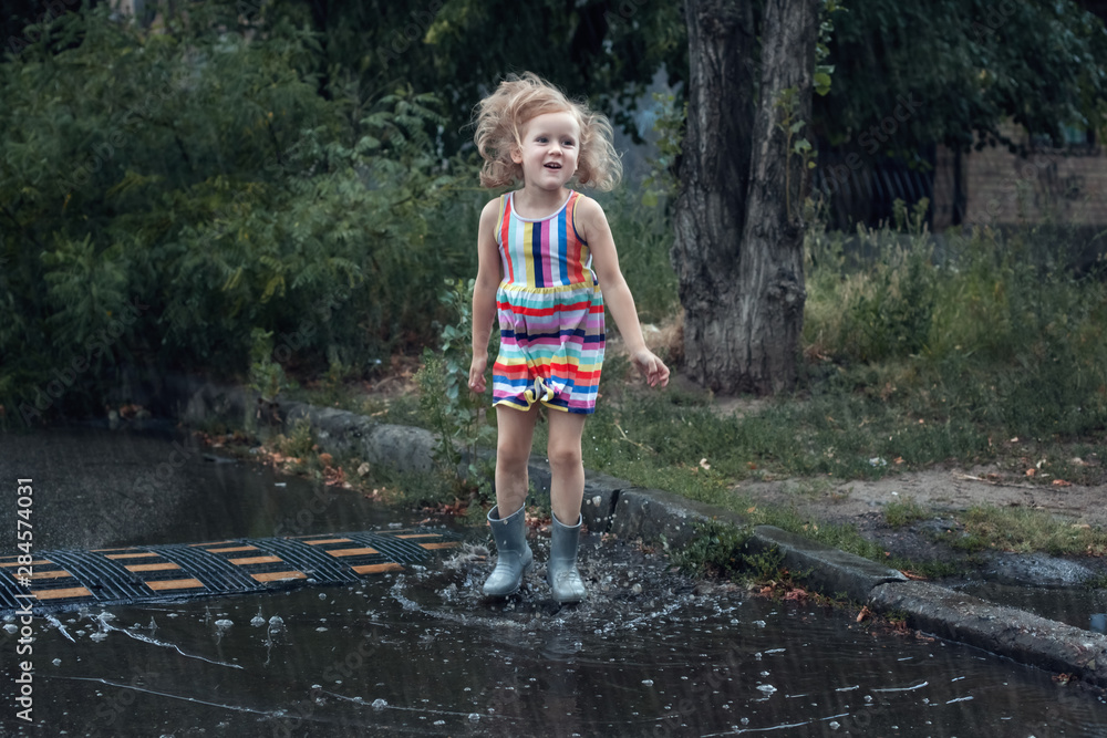 Girl jumping in the rain. Girl jumping in the rain.