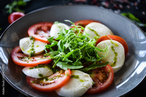 italian caprese salad with fresh mozzarella, tomatoes & basil