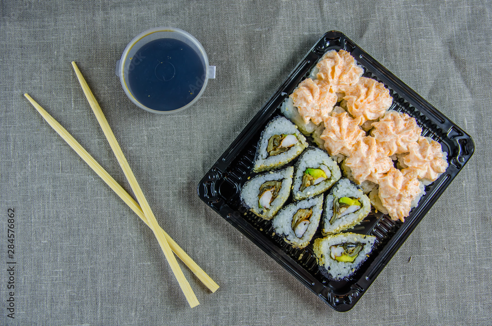 delivery of rolls at home. Sticks, soy sauce. delivery of rolls at home. Sticks, soy sauce.