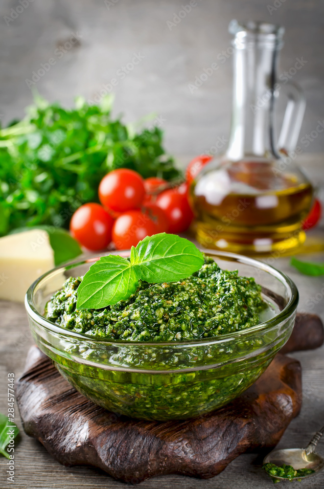 Homemade basil pesto with pine nuts, parmesan and garlic. Homemade basil pesto with pine nuts, parmesan and garlic.