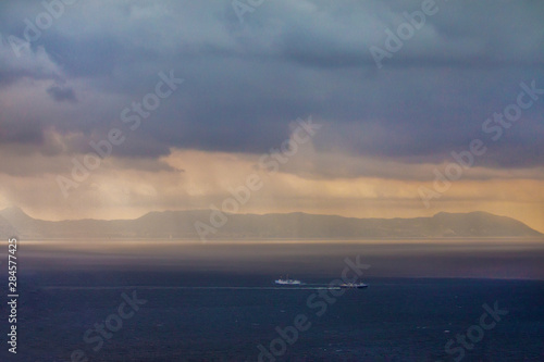 Majestic view on sky, sea and ship at far distance. South Italy. Eoad Salerno- Amalfi.