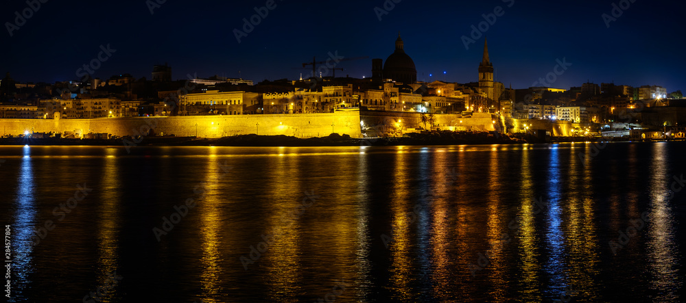 View over the Valletta city from Marsans Harbour in night