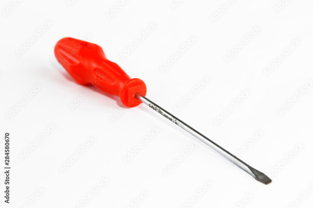 old rusty metal screwdriver for screws with red handle old rusty metal screwdriver for screws with red handle