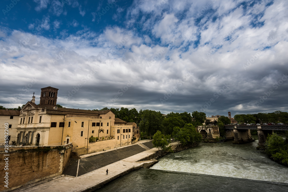 Tiberina island (Isola Tiberina) in Tiber river, Rome, Italy. Tiberina island (Isola Tiberina) in Tiber river, Rome, Italy.
