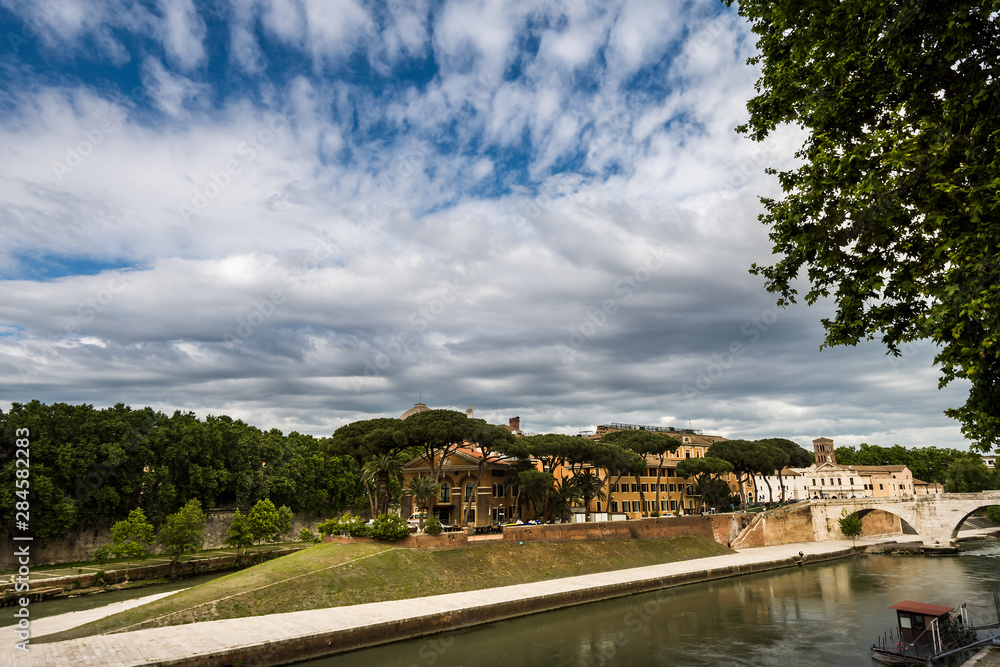 Tiberina island (Isola Tiberina) in Tiber river, Rome, Italy. Tiberina island (Isola Tiberina) in Tiber river, Rome, Italy.