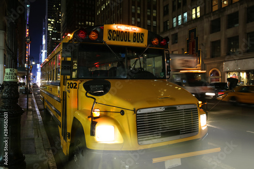 School bus parked on the side of a street in New York City Manhattan photo