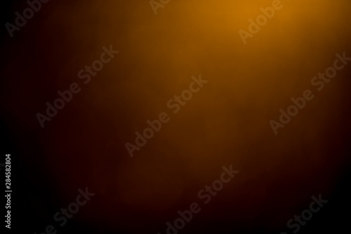 Golden bokeh mistical abstract background. Defocused light. photo