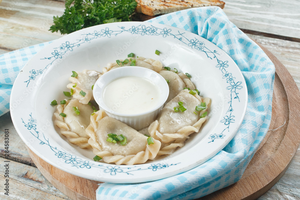classic dumplings on a wooden table classic dumplings on a wooden table