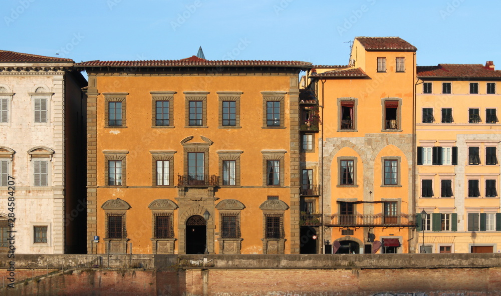 Palazzo Roncioni facade elevation in the evening sun in Pisa, Italy