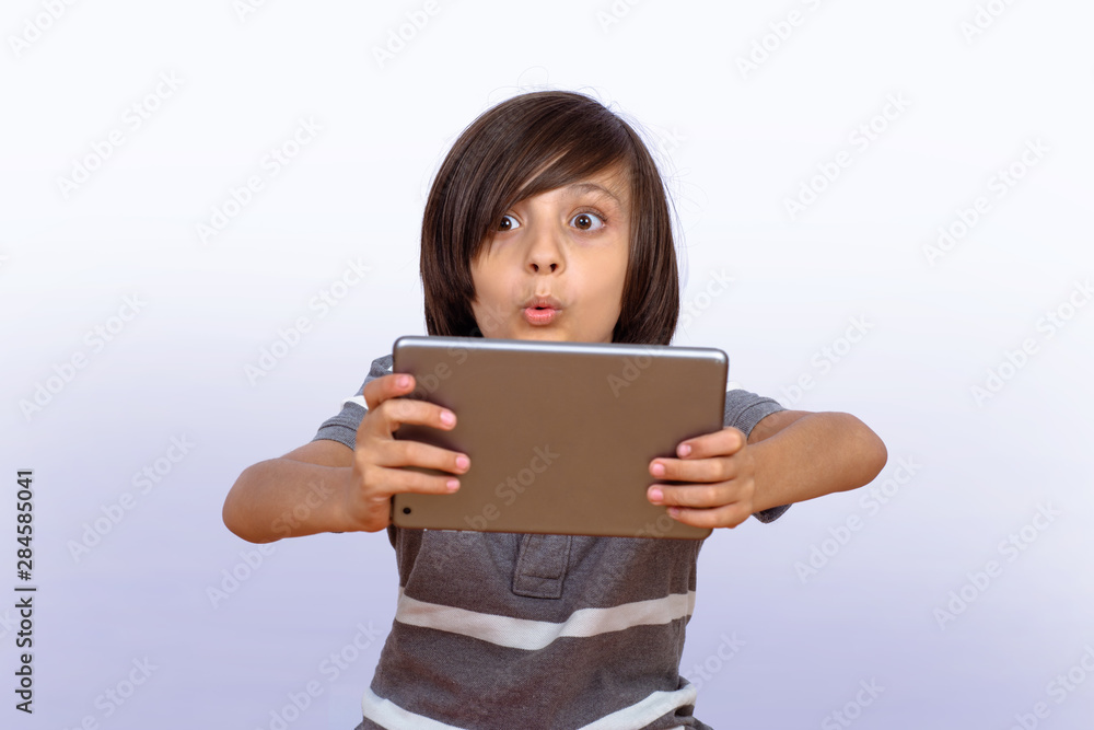 Little boy using digital tablet. Little boy using digital tablet.
