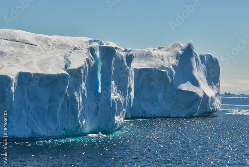 Two Icebergs Abutted with One Face Fracturing on Sunny Day in Antarctica