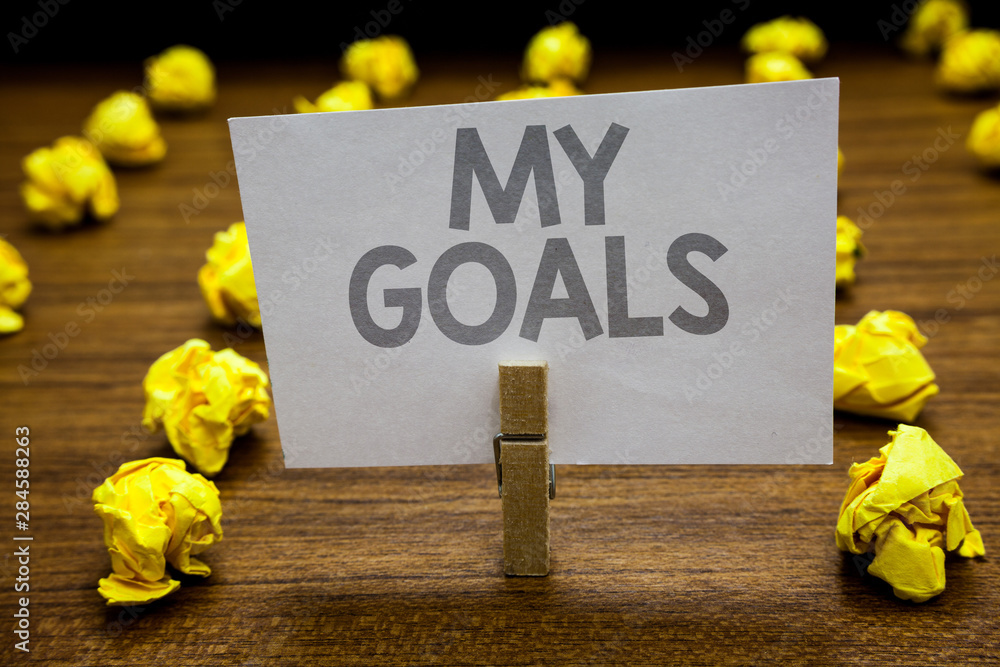 Naklejka premium Word writing text My Goals. Business concept for Future or desired result that a person commits to achieve Clothespin hold holding paper idea reminder crumpled papers several tries