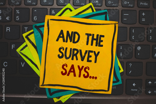 Word writing text And The Survey Says.... Business concept for doing poll and bring the results discuss with others Multiple colour sticky border cards computer keyboard text send message