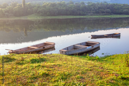 idyllic nature with boats in the morning