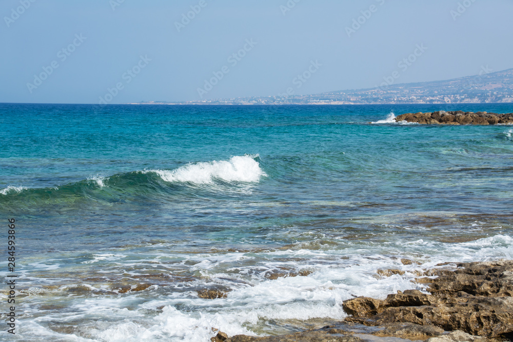 Seascape of the Mediterranean Sea with waves of the turquoise sea on the volcanic coast of Cyprus Seascape of the Mediterranean Sea with waves of the turquoise sea on the volcanic coast of Cyprus