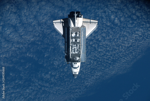 Space shuttle with a load of satellites, top view. Elements of this image were furnished by NASA