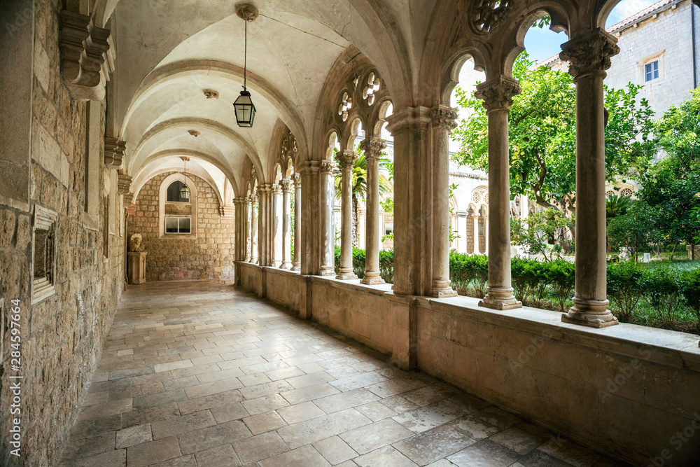 Courtyard with columns and arches in old Dominican monastery in Dubrovnik, Croatia