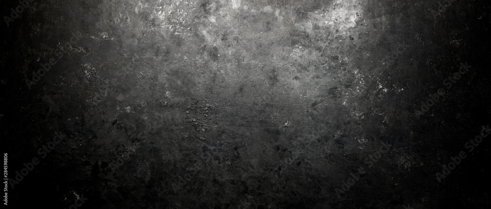 Rough, dark stone background lit by spotlight background