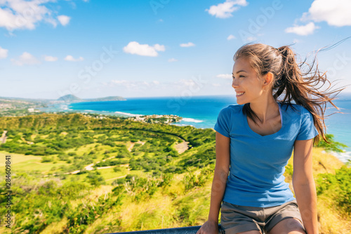 Hawaii hiker tourist Asian woman hiking the Diamond Head State Monument park famous tourism attraction things to do in Honolulu City view of Waikiki. Summer travel.