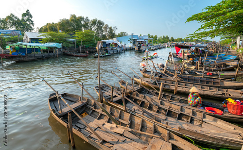 Wallpaper Mural Wharf in the afternoon in the Mekong Delta with many boats await guests across the river is very busy as culture in Soc Trang, Vietnam Torontodigital.ca