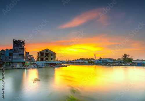 Sunset landscape on the beautiful riverbank the Mekong Delta in Soc Trang, Vietnam