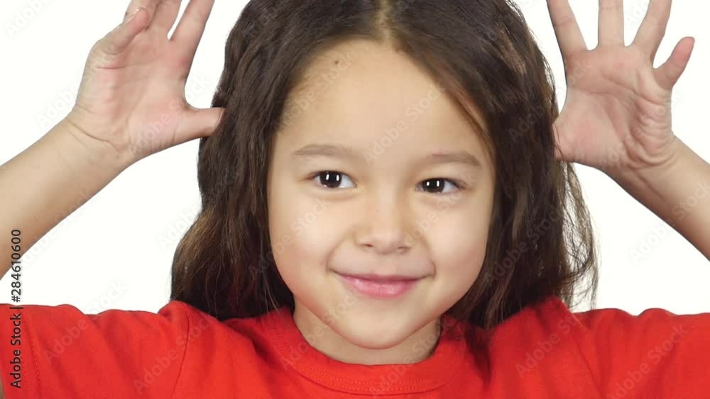 Close-up happy little girl have fun and act the ape. Slow motion Close-up happy little girl have fun and act the ape. Slow motion
