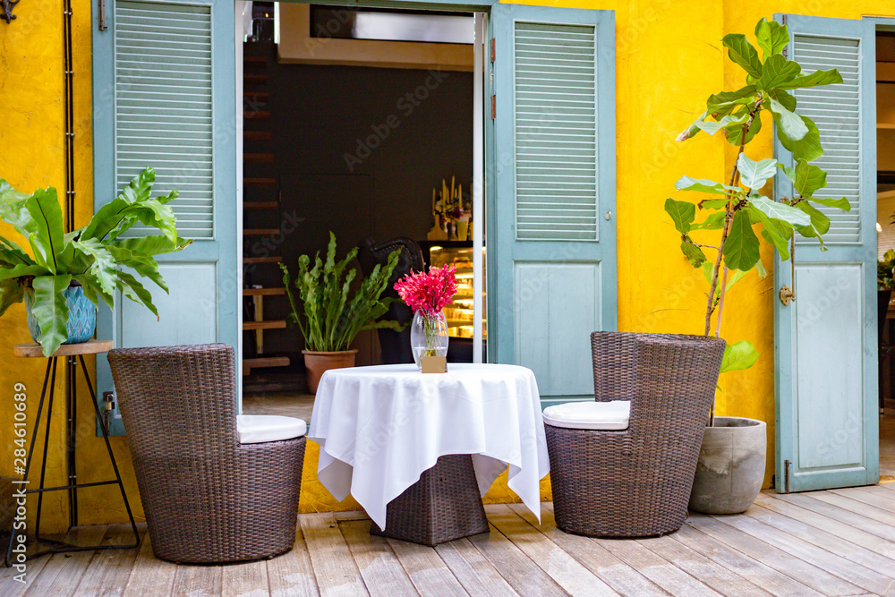 Set if chairs and table outside coffee shop