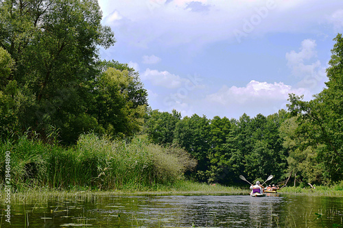 Vorskla river, tourists on a kayak.