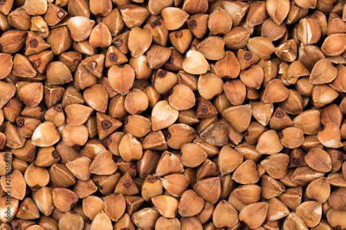 Macro Photo food buckwheat groats. Texture background grain buckwheat groats. Image food product porridge buckwheat grains