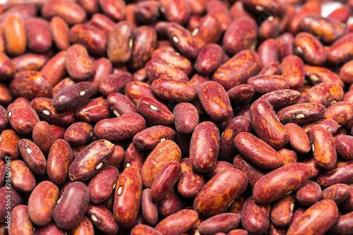 Red kidney bean texture background. Also called Rajma or Mexican Bean. A large, kidney-shaped bean with a subtle sweet flavor and soft texture that keep their shape during cooking.