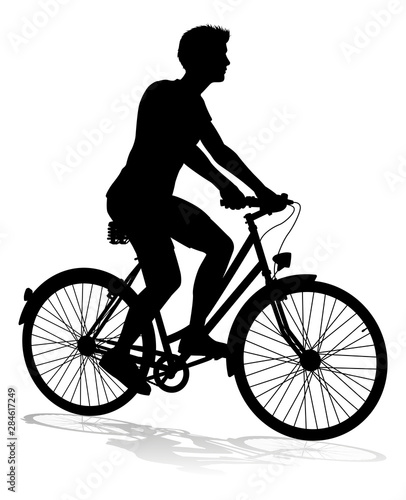 A bicycle riding bike cyclist in silhouette