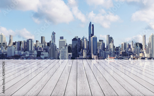 Panoramic city view with empty white wood floor
